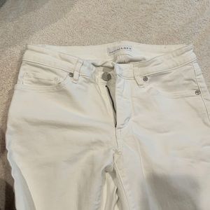 Adorable white jeans with ankle fringe